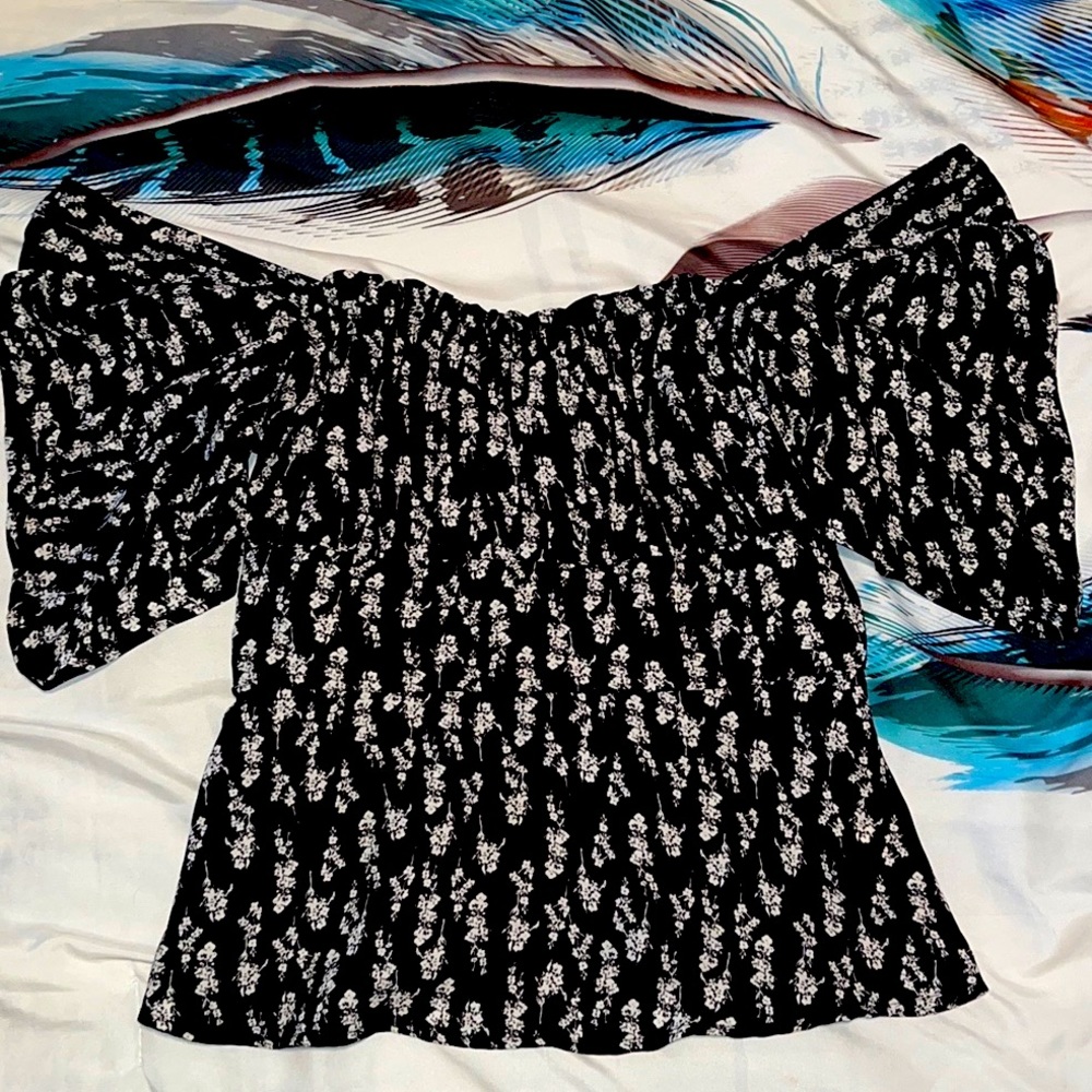 Beautiful Black ruffle shirt with floral design. Perfect for cute pictures.